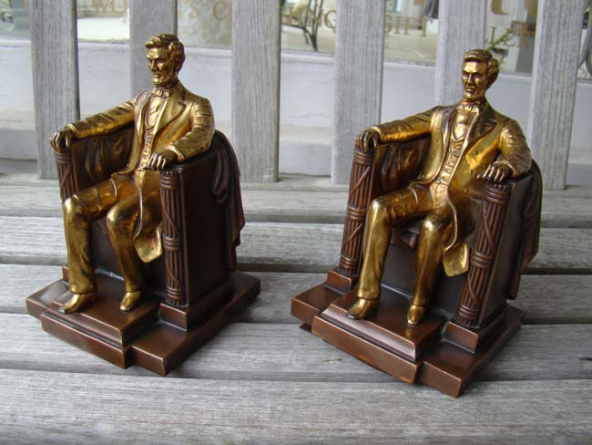 A pair of "Lincoln in the chair" bookends made by Jennings Brothers of Bridgeport, CT., circa 1930